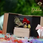 A box with a Forever flower and a gift jar