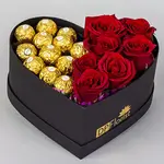 Box of roses and chocolate in the shape of a heart