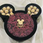 Box of roses and chocolate in the shape of a bear