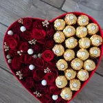 Box of roses and chocolate in the shape of a heart