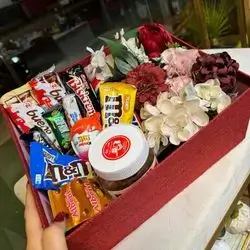 A Box Of Flowers And Sweets