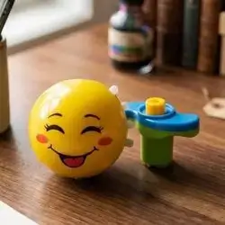led light and music emoji spinning top
