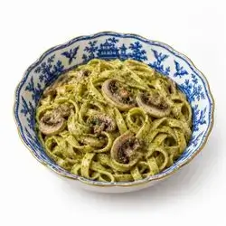Fettuccine with mushrooms and pesto sauce