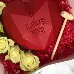 A Breakable Heart Box With Small Chocolate Pieces Inside