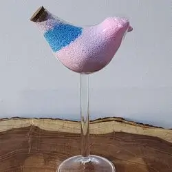 Sand Candles Inside A Glass Bird