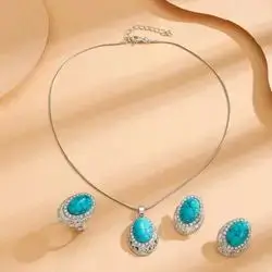 Necklace With Earrings and a Ring Decorated With Turquoise Stones