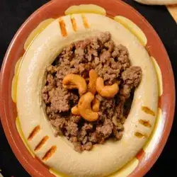 A Plate of Hummus With Tahini and Meat