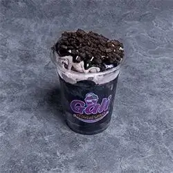 A Cup Of Oreo Ice Cream And Oreo Sauce