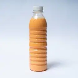 Large Bottle Of Carrots, Apples, And Bananas
