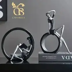 Two Woman Shaped Figurines With A Circular Base