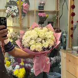 White Rose Bouquet in Pink Wrap