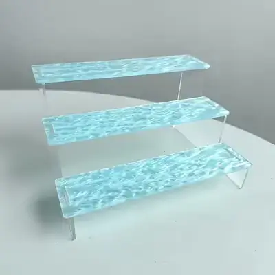 Transparent Acrylic Three-Tier Display Stand with a Wave Pattern Design