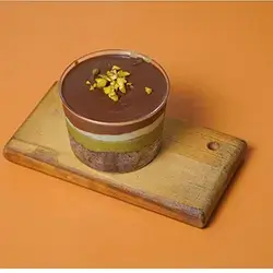 Pistachio Cake Luxury Brownie Cake Layered With Cream Filled And Topped With Pistachio And Nutella Cream