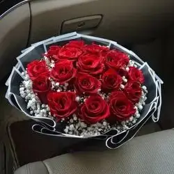 Bouquet Of Red Roses With The Addition Of A Lot Of Gypsophila