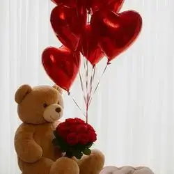 A Bouquet Of Red Roses, A Teddy Bear, And 10 Red Heart-shaped Balloons