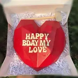 A Heart Box With Heart-shaped Chocolate Pieces Inside