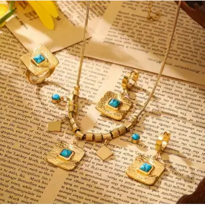 Necklace, Ring and Earrings Decorated With Turquoise Stones