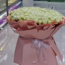 A Huge Bouquet Of White Roses With Packaging