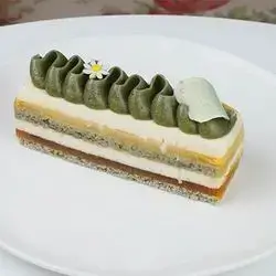 Pistachio Mango Passion Fruit Cake Slice