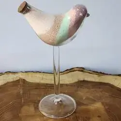 Sand Candles Inside A Glass Bird