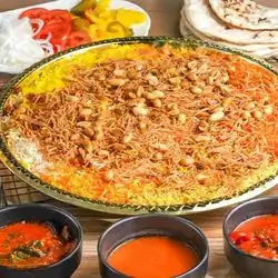 Two People, Rice And Small Mansaf Broth