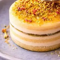 Cheese dessert piece with pistachios
