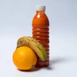 Small Bottle Of Banana, Orange, And Carrot