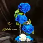 A glass bell containing a Forever rose
