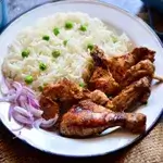 Broth And Rice With A Slice Of Chicken