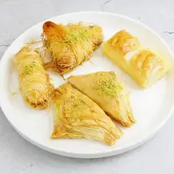 Mix Syrian Sweet With Cream And Ghee