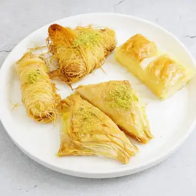 Mix Syrian Sweet With Cream And Ghee