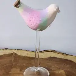 Sand Candles Inside A Glass Bird