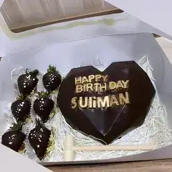 The Heart Box With Chocolate Pieces In The Shape Of Small Hearts Inside