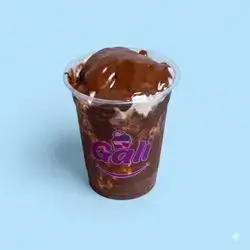 A Cup Of Pistachio Ice Cream And Nutella Sauce
