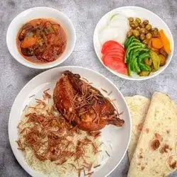 Half Chicken On Rice And Broth
