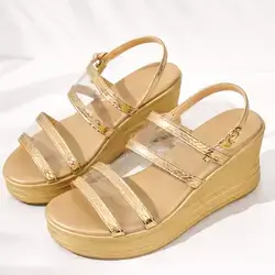 Chic gold wedge sandals featuring metallic textured straps and clear bands - Size: 37