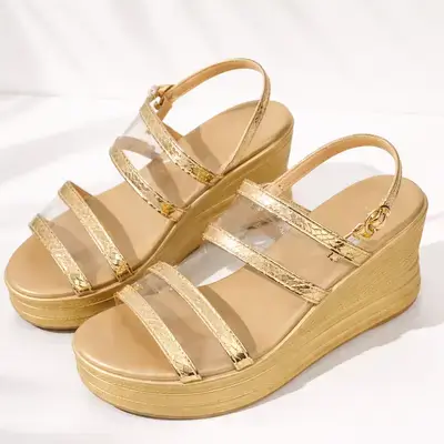 Chic gold wedge sandals featuring metallic textured straps and clear bands - Size: 37