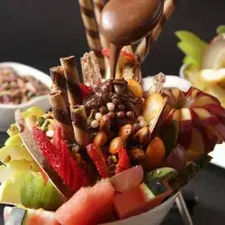 Fruit Salad with Pieces of Chocolate and Nutella