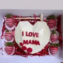 White Heart Box Decorated With Chocolate Roses And Small Pieces Of Chocolate Inside.