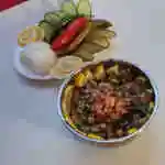 Fatteh plate with tahini, salad, and bread