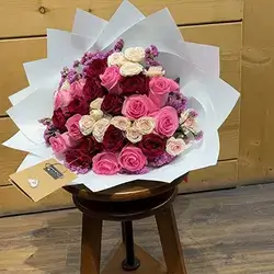 Pink and Red Rose Bouquet in White Geometric Wrap