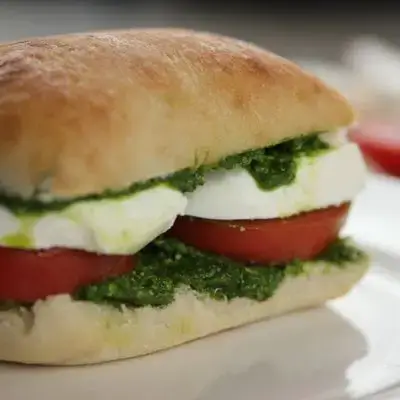 Mozzarella and pesto with tomatoes italian bread