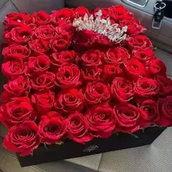 A Box Of Flowers And Crown