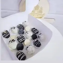 A Box Dates Stuffed With Nuts, Covered in Chocolate