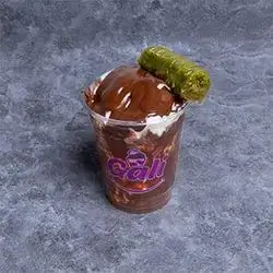 Ice Cream Cup With Pistachio And Baklava With Nutella Sauce