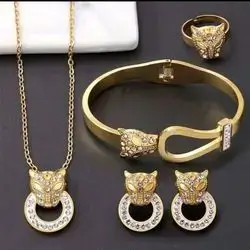 Necklace with earrings, bracelet and ring in a tiger head design studded with zircon